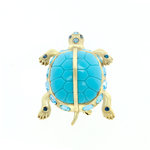 TORTUGA - TORTUGA is a brooche with the shape of a little turtle to wear it always to catch all the good vibrations! it's a jewel made of light gold and acquamarina, with sapphire and aquamarina stones. - A.Z. Bigiotterie